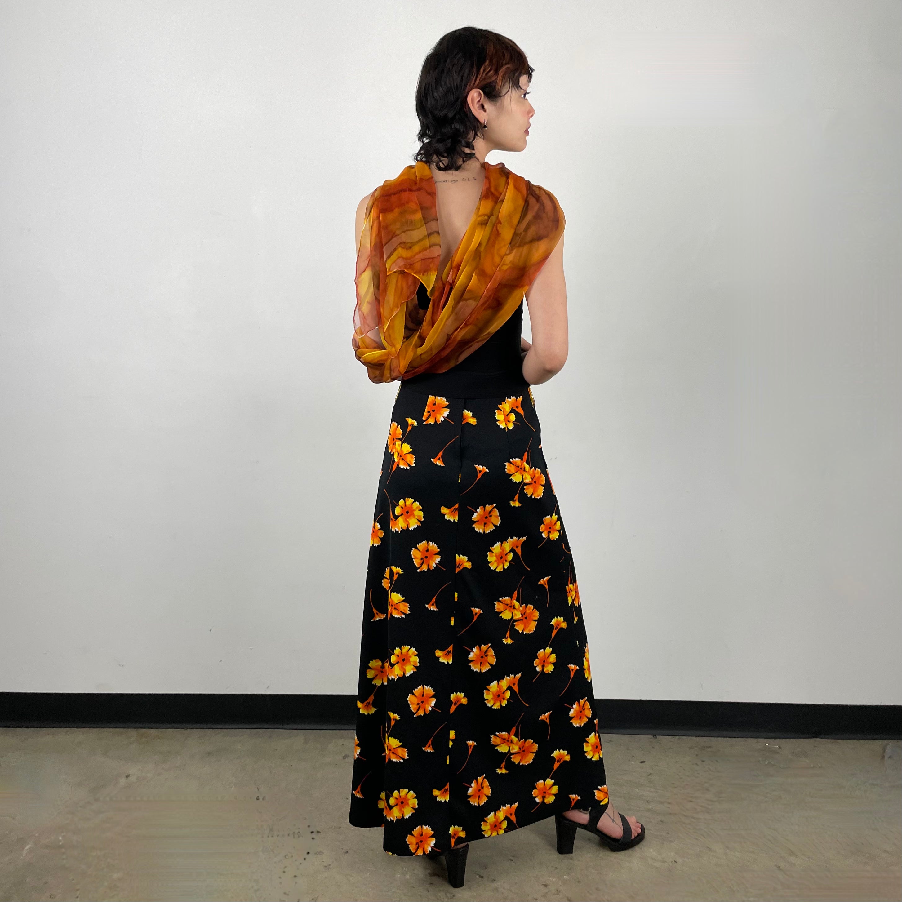 Back view of 70s Black Floral Printed Maxi Skirt 
Size Extra Small/Small
Sold at bohemevintage.com 
Montréal 