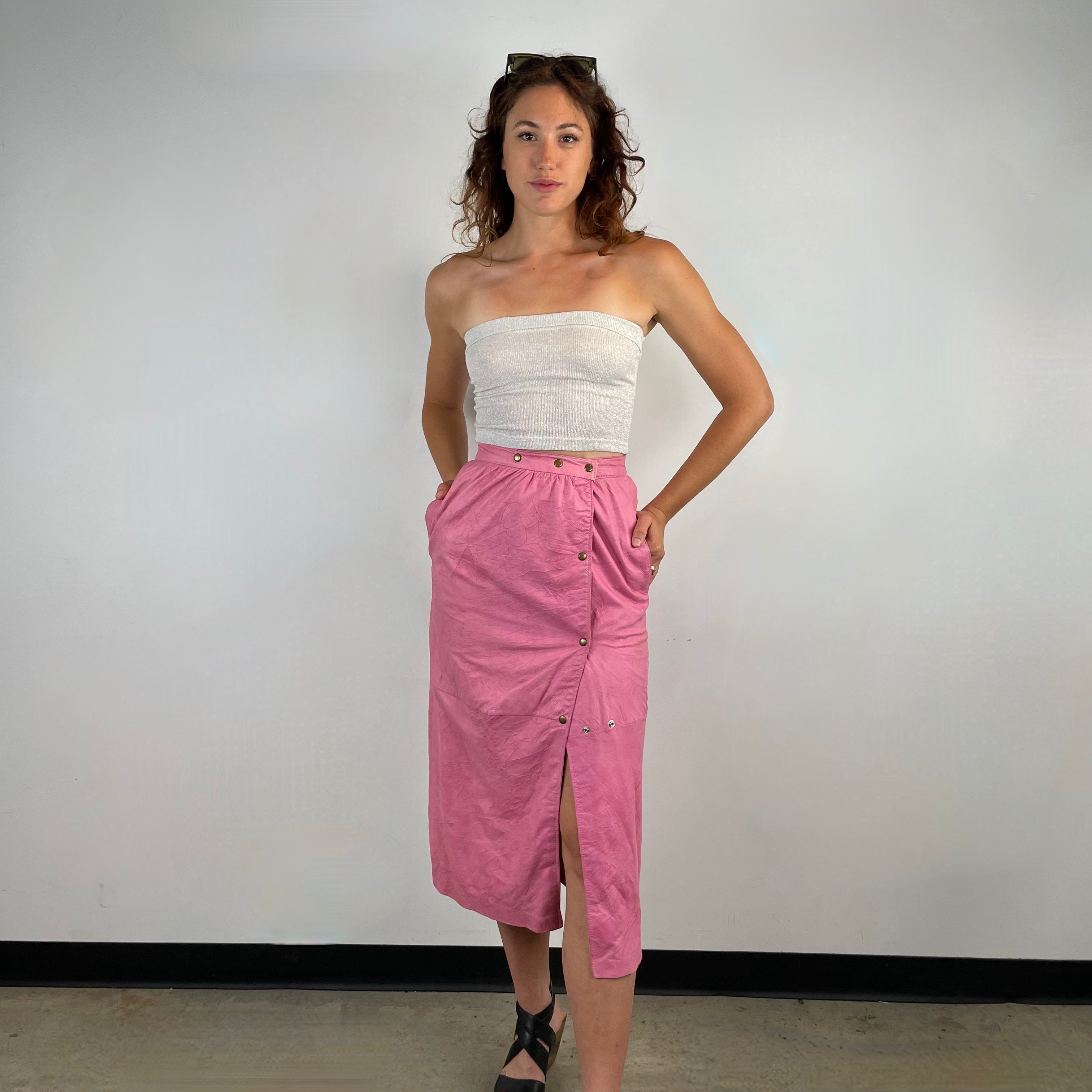 Front view of 1980s Robert Krief Designer Pink Leather Midi Skirt 
Size Small/Medium
Sold at bohemevintage.com 
Montréal 