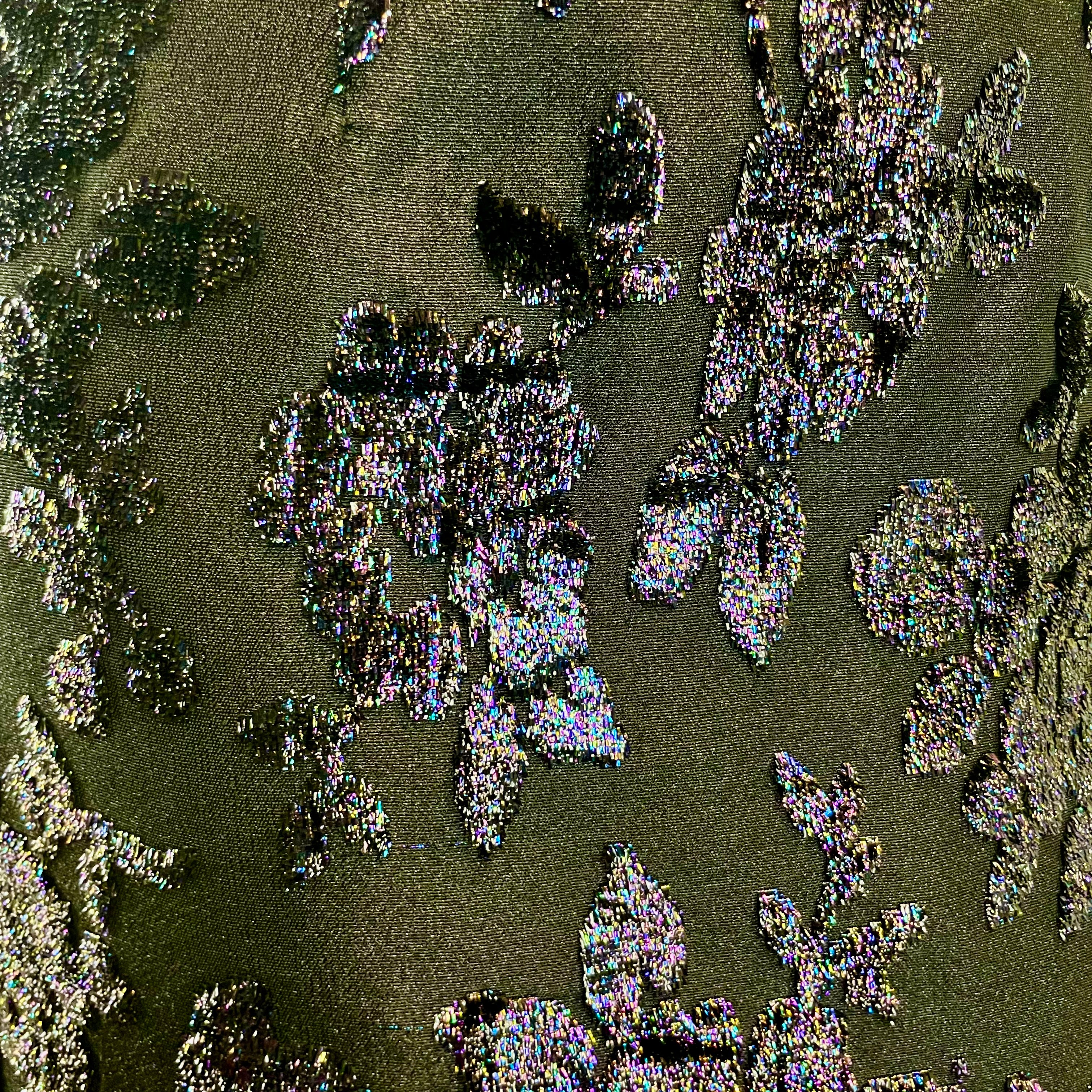 Close up view of brocade fabric of  1950s-1960s Floral Brocade Black Iridescent Cocktail Dress Size Medium sold at bohemevintage.com Montreal