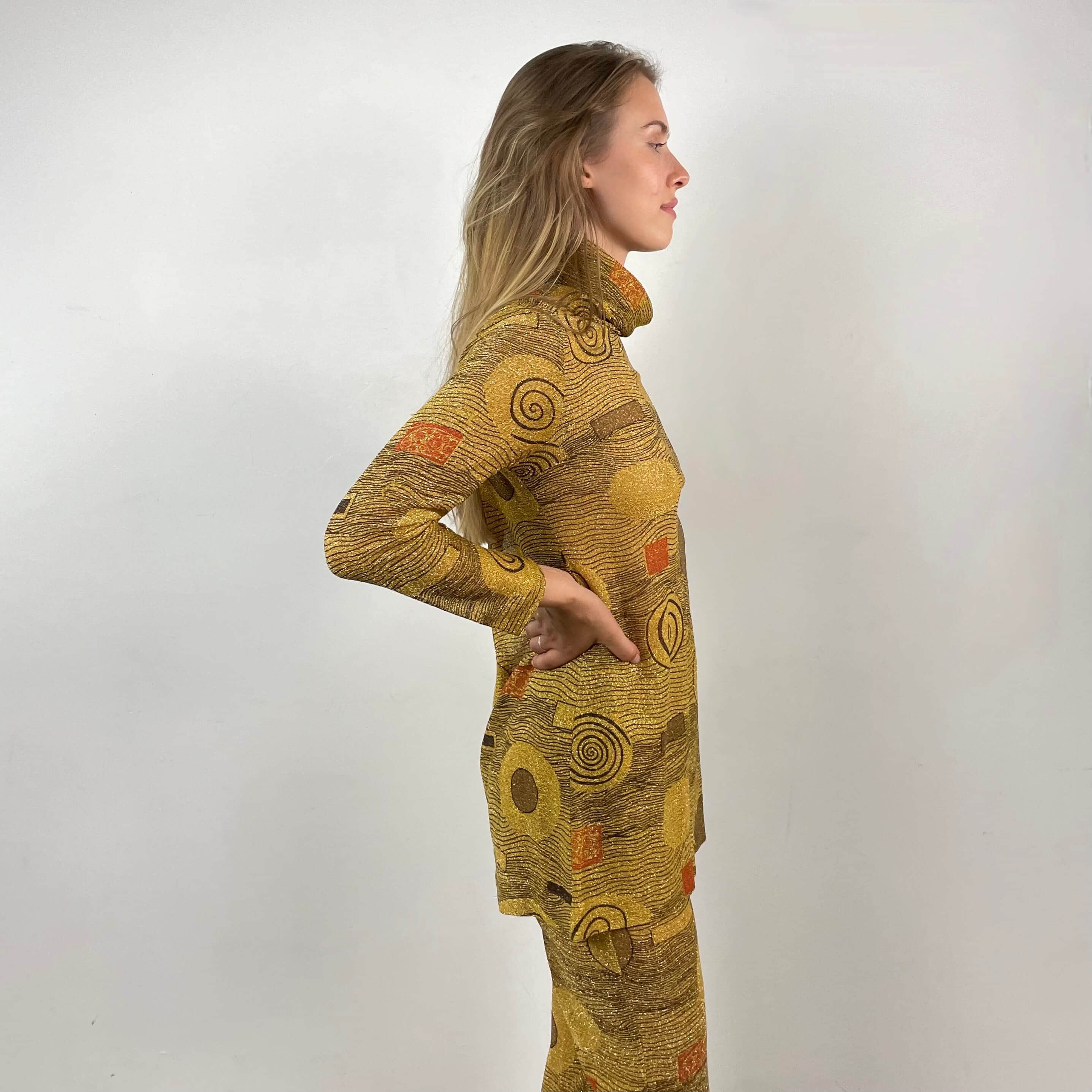 Side view of 1960s/70s Gold Patterned Mini Dress and Pant Set Size small sold at bohemevintage.com Montreal