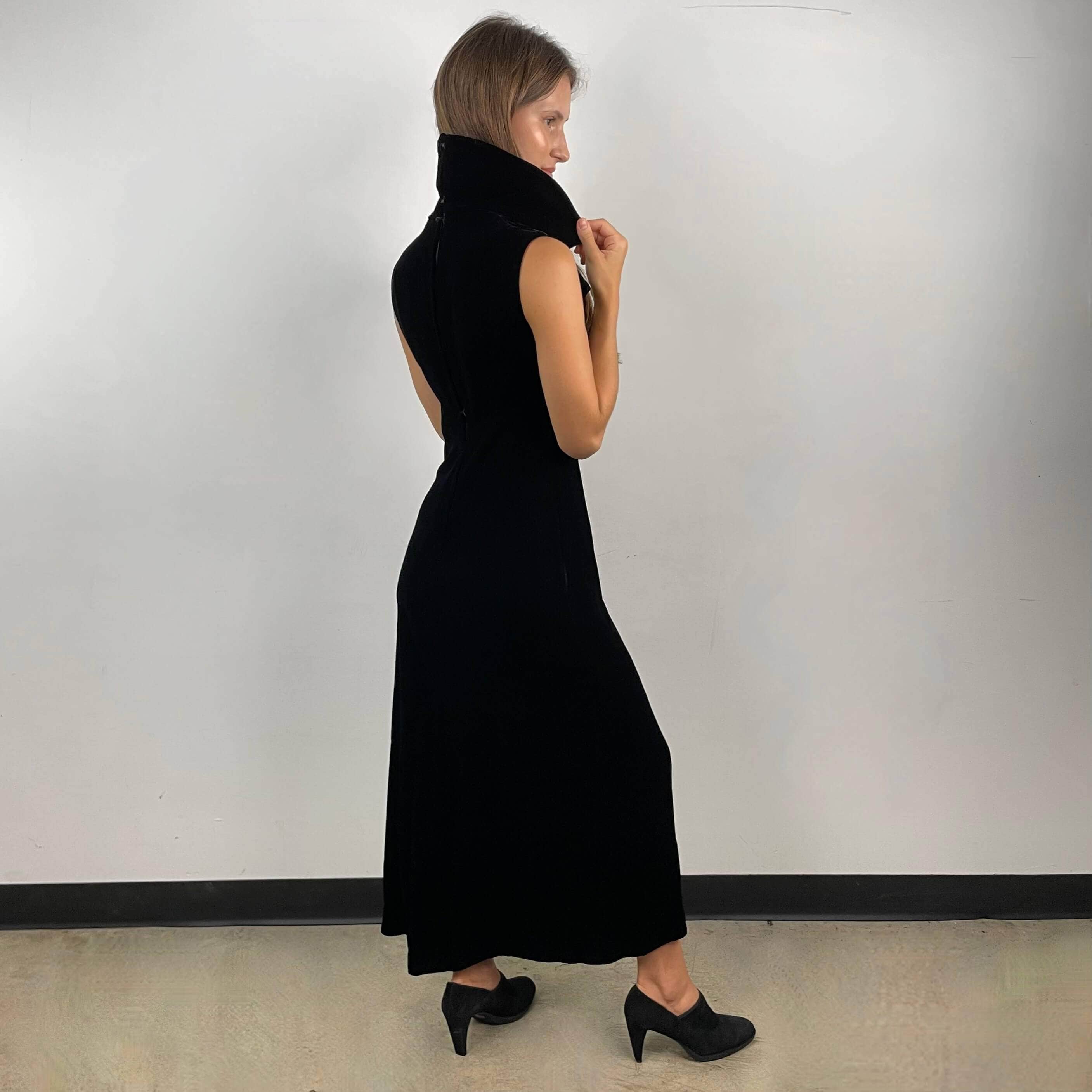Side view of 1970s Deep V-Neck Black Velvet Midi Dress Size Small sold on bohemevintage.com Montreal