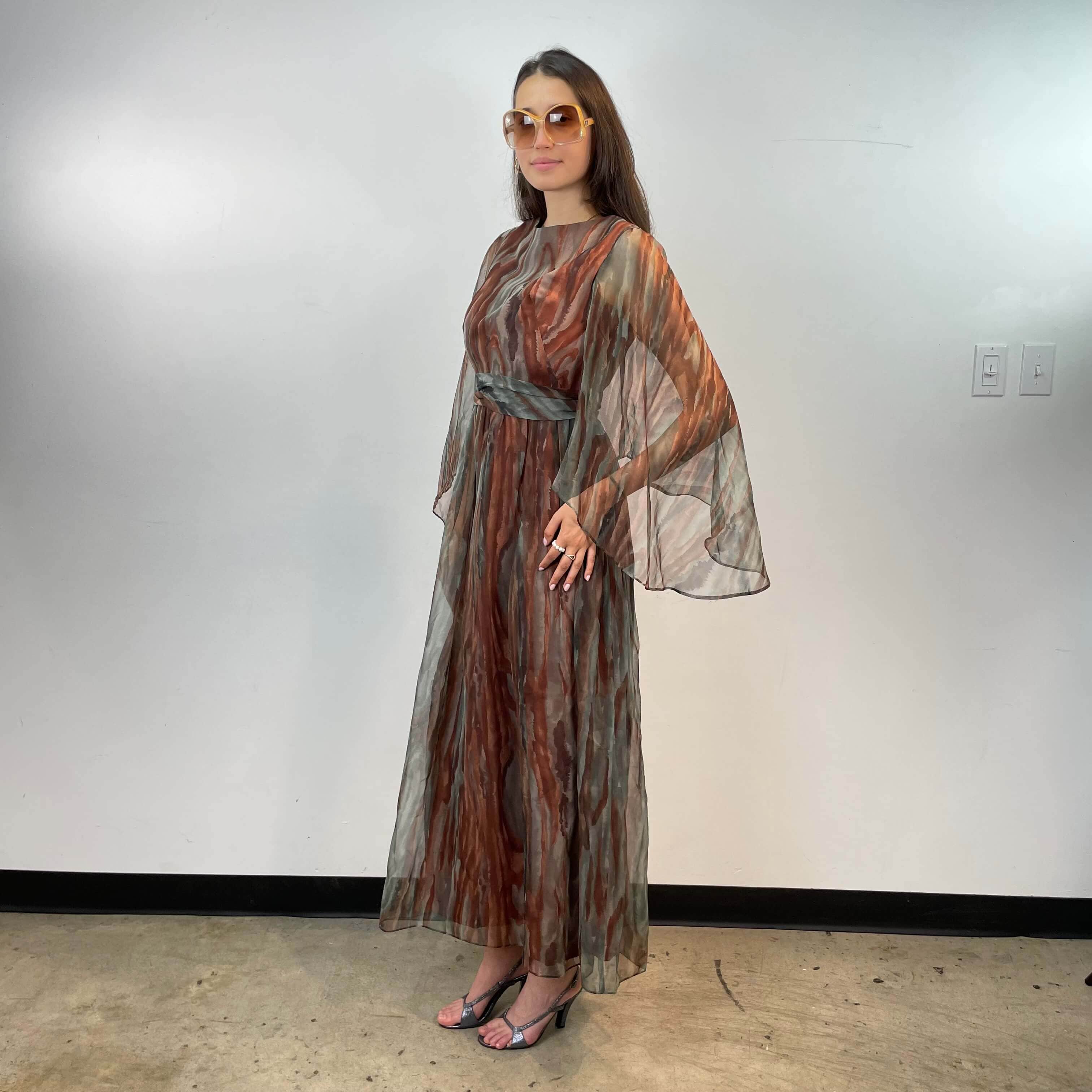 Front and side view of 1970s Floor-Length Boho Chic Flowy Gown size Small/Medium sold at bohemevintage.com Montreal