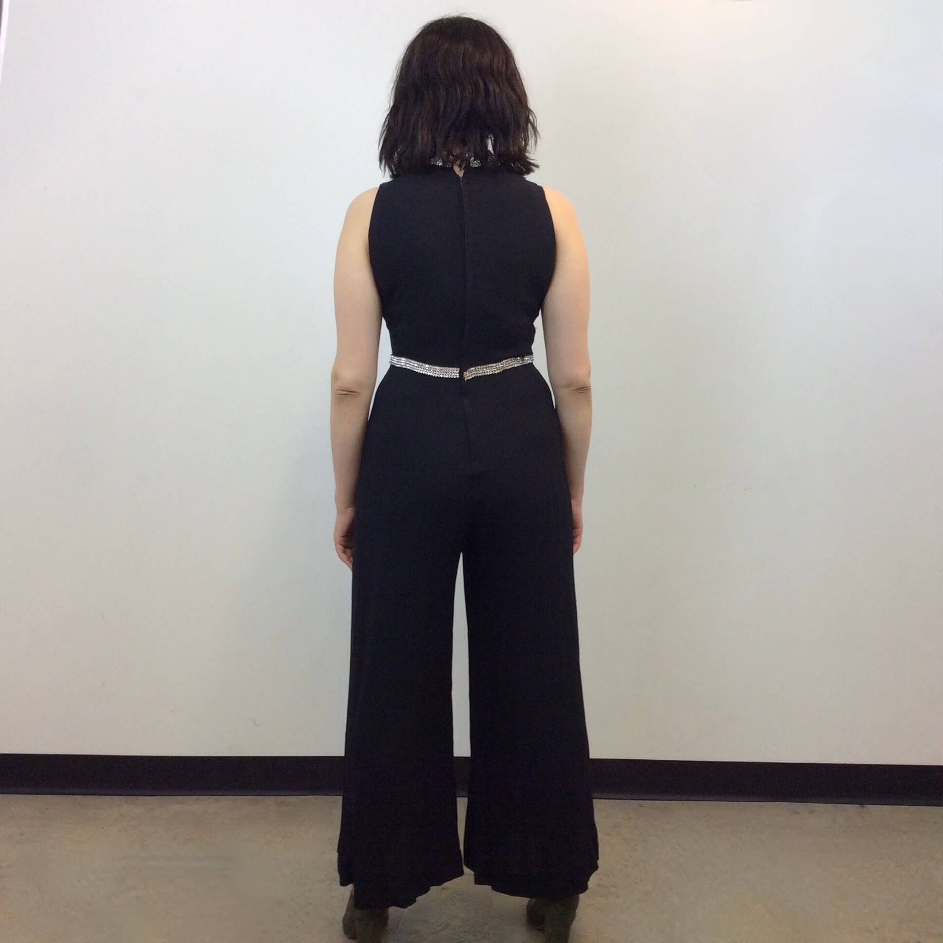 Back view of 1960s Wide Leg Black Evening Jumpsuit Size Medium sold at bohemevintage.com Montreal