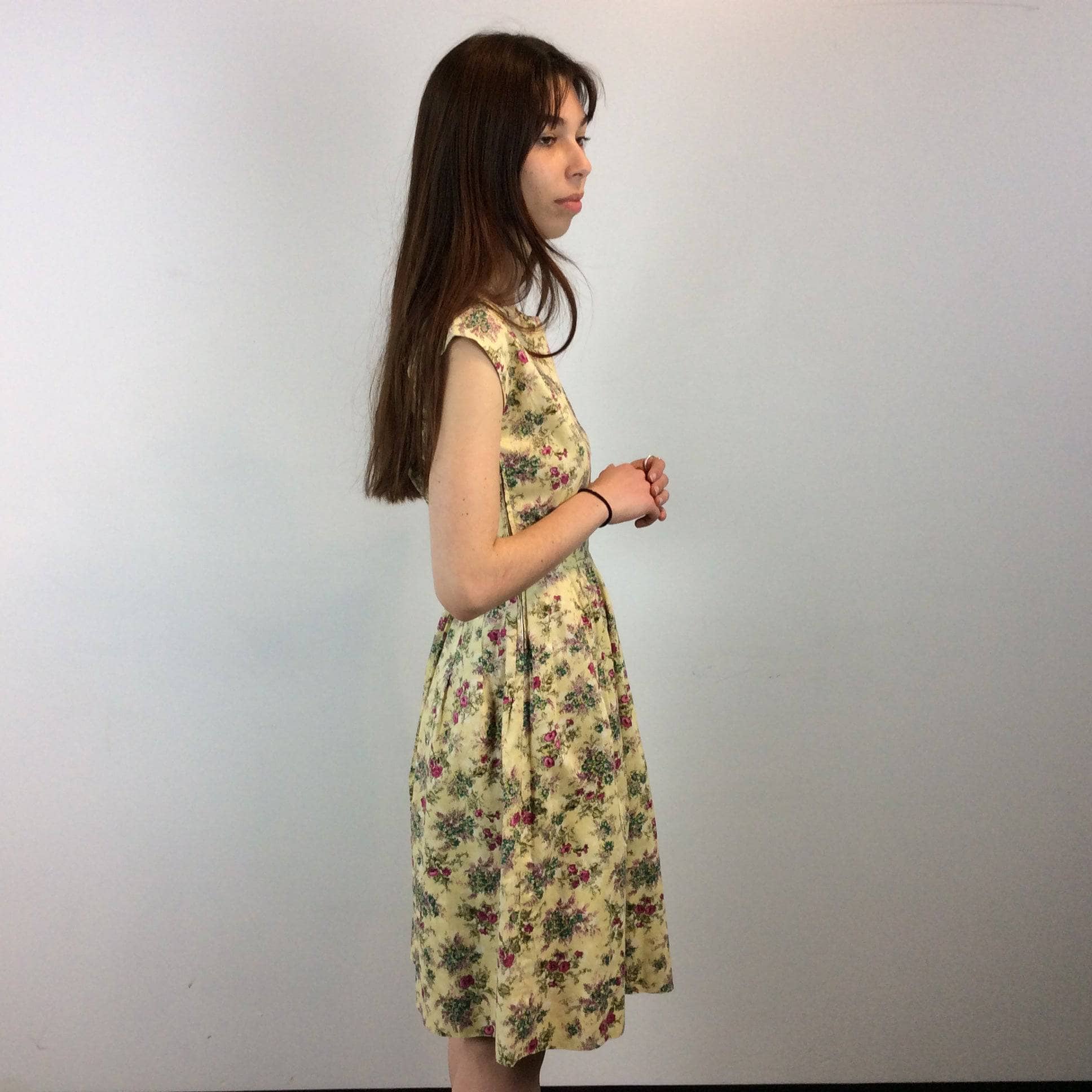 Side view of 1950s-60s Convertible two-piece Yellow Floral Print Cotton Dress and Bolero Jacket Set , Size Small sold by bohemevintage.com Montreal