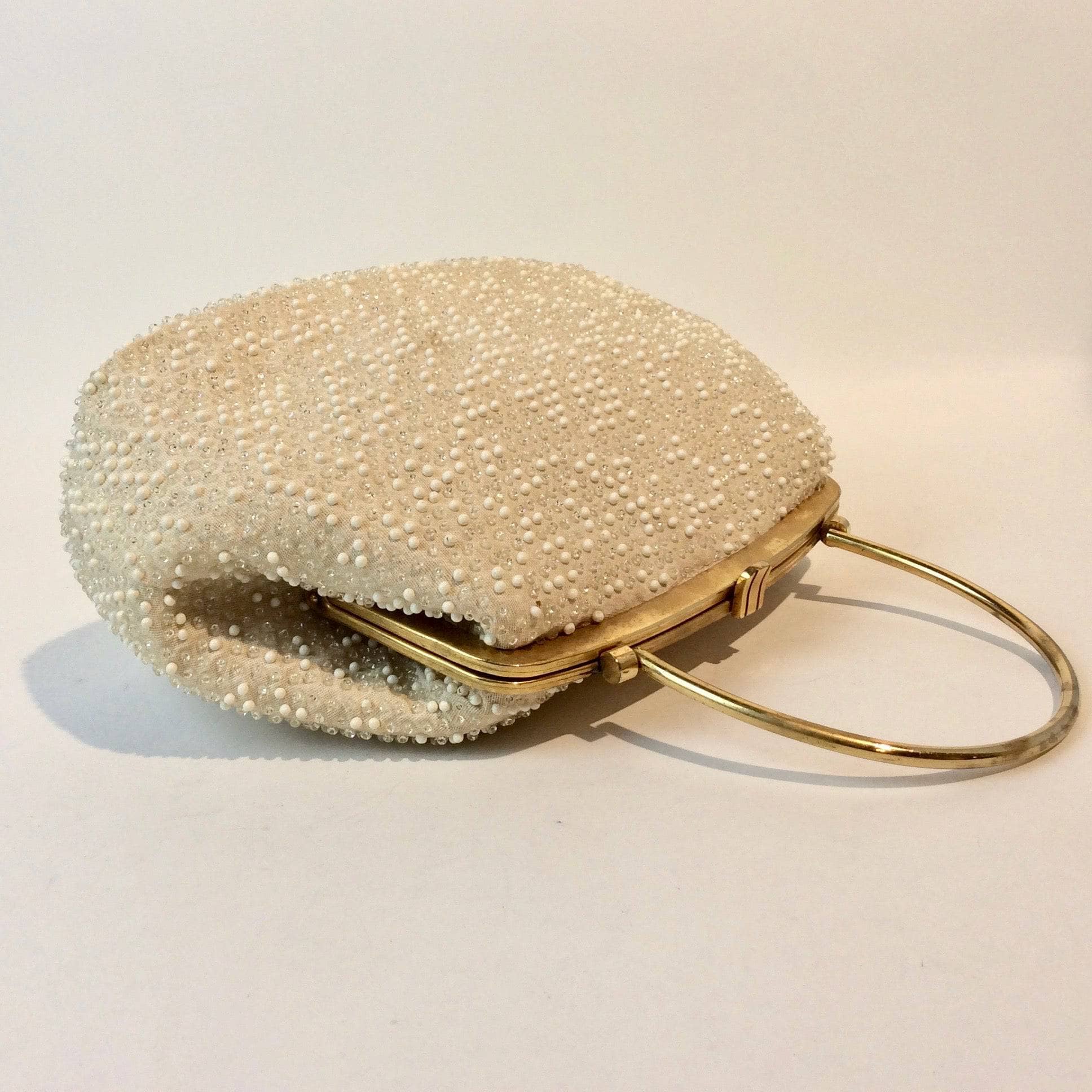 1960s Cream Grandee Beaded Handbag with Brass Handle. Sold by bohemevintage.com Montréal