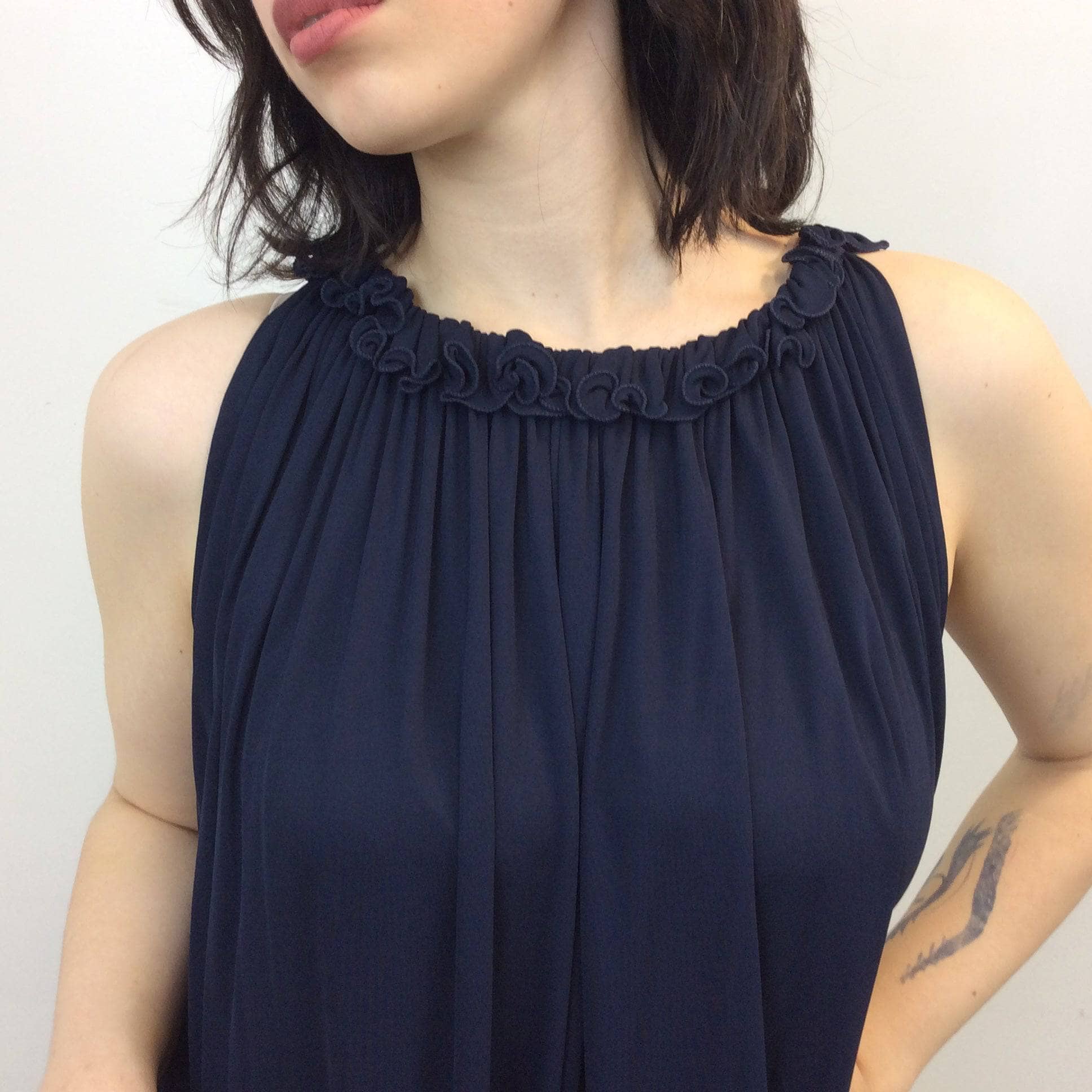 Close up of neck detailing of 1970-80s Jean Varon Designer Navy Blue Trapeze Midi Dress size Medium/Large sold by bohemevintage.com in Montreal