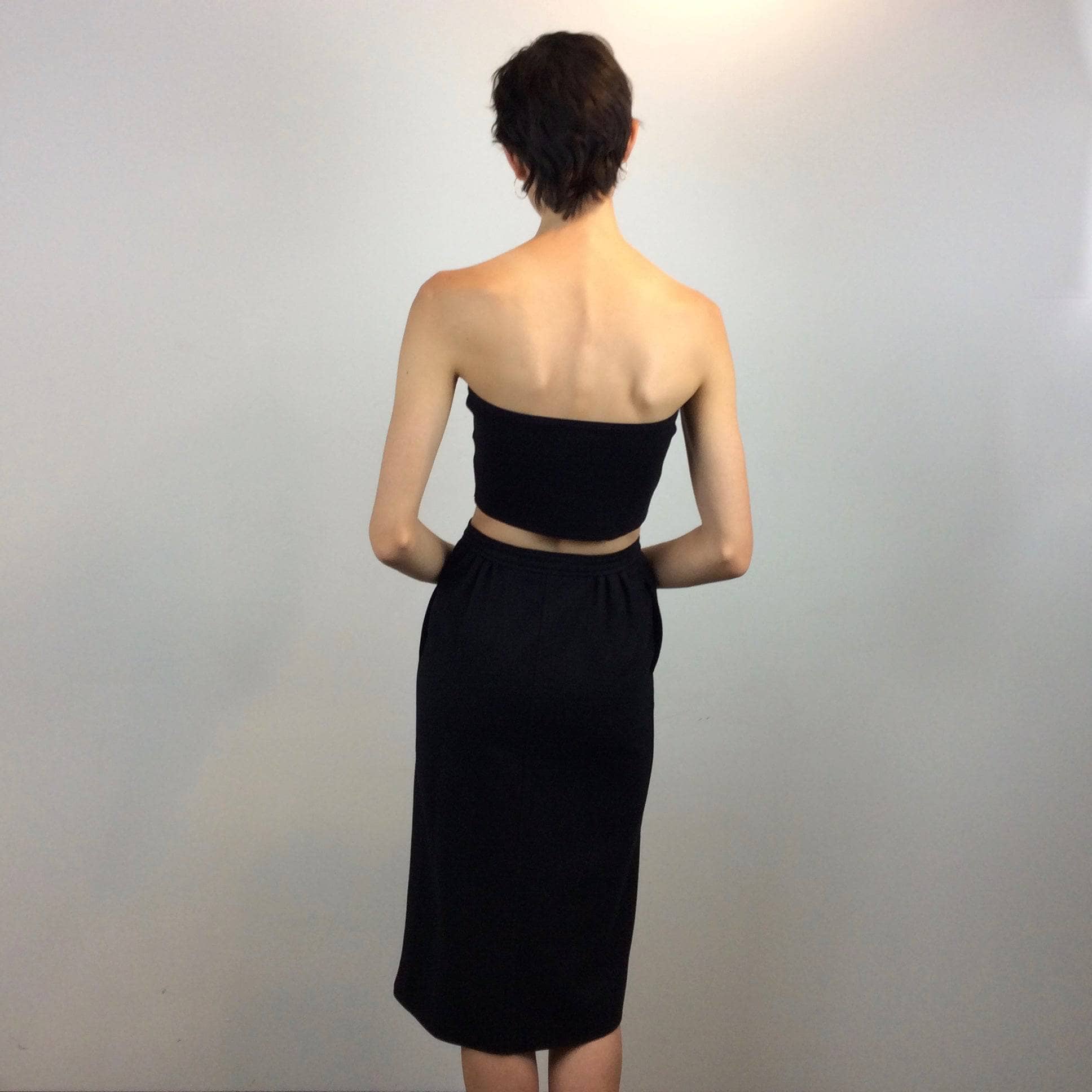 Back view of 1970s-1980s Courrèges Black Cashmere and Wool Midi Pencil Skirt Size Small Sold by Boheme Vintage Montreal