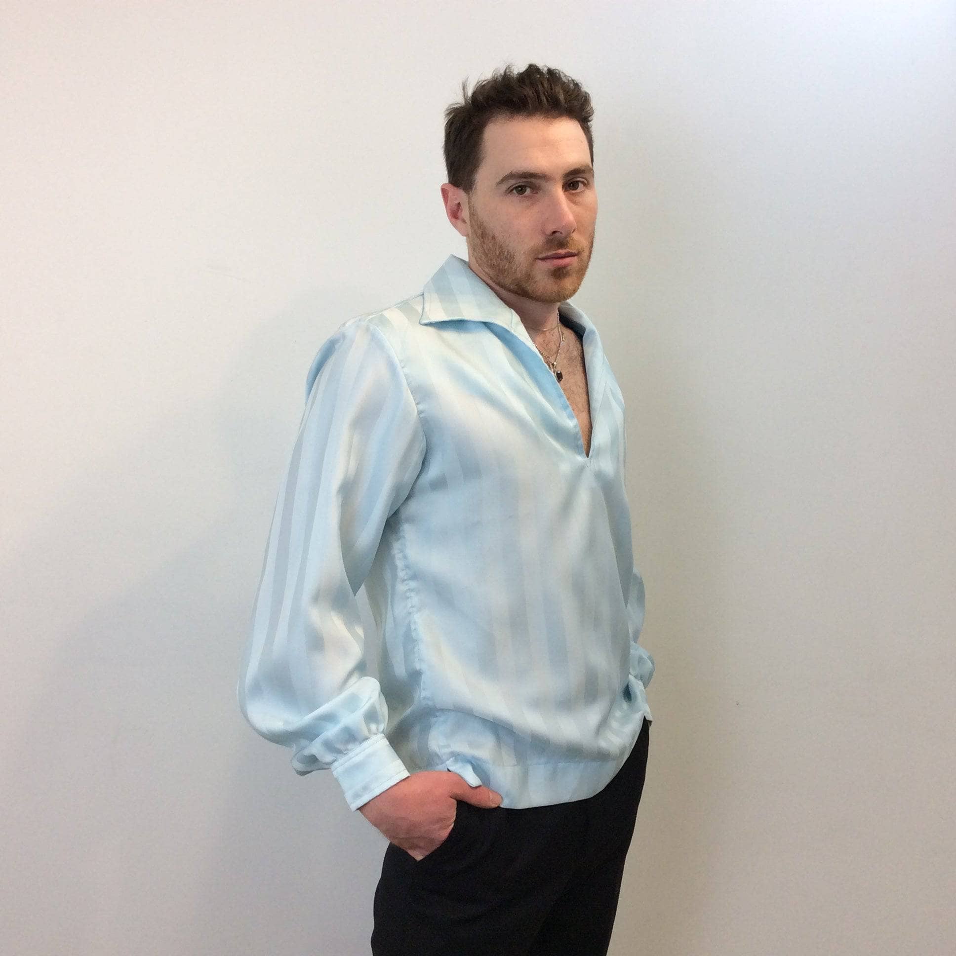 Side view of 1970s Disco Men's Light Blue Popover Disco Shirt, sold by bohemevintage.com Montréal