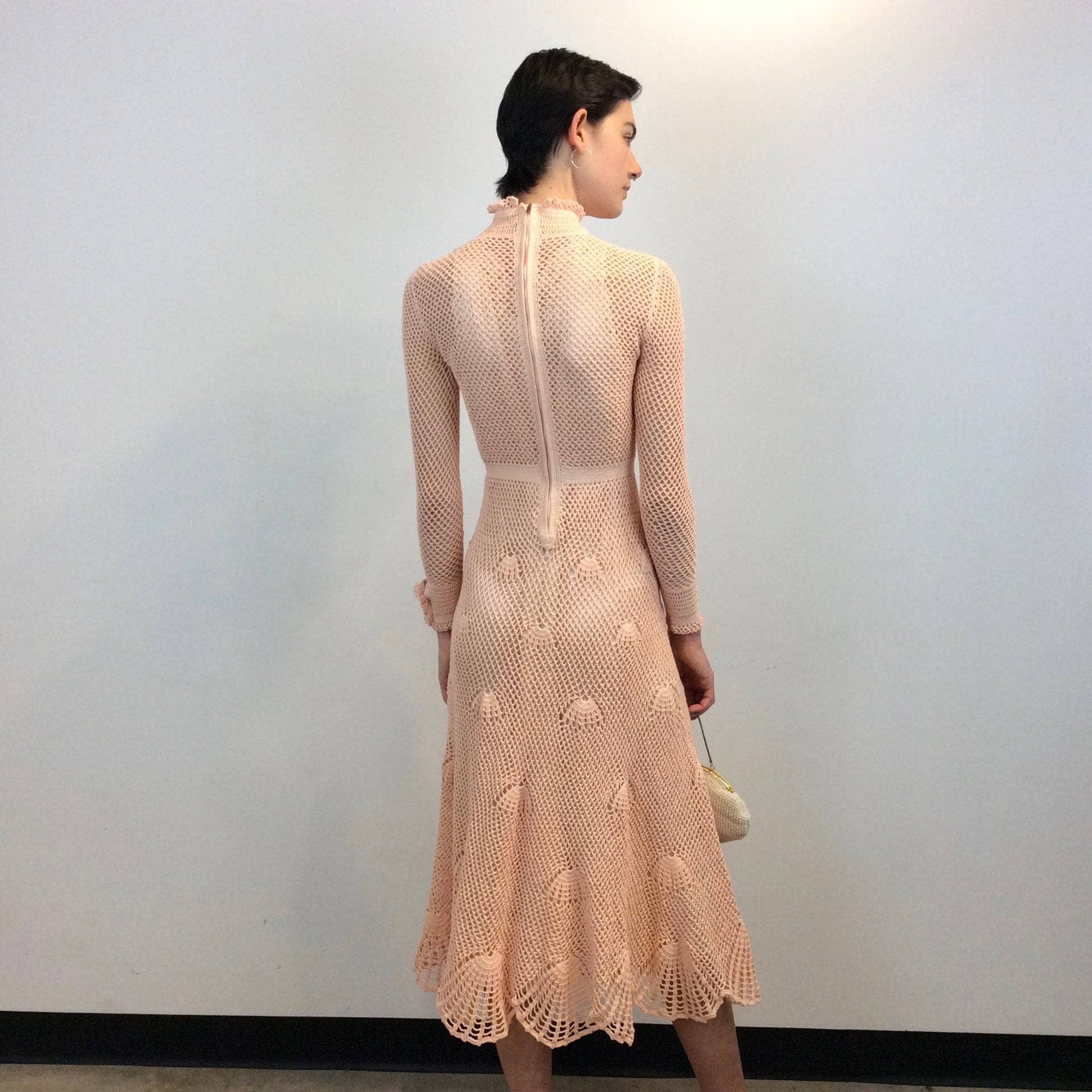 Back view of 1970s Long Sleeve Crochet Mesh Midi Dress Size Small sold by bohemevintage.com Montreal